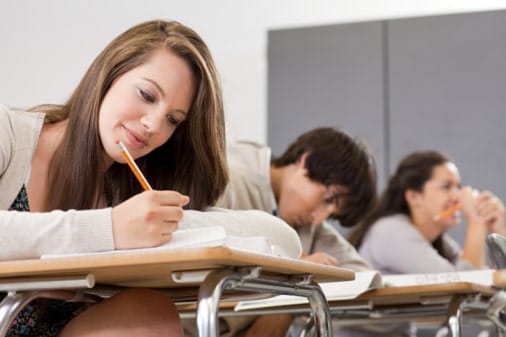 Girl taking test in classroom