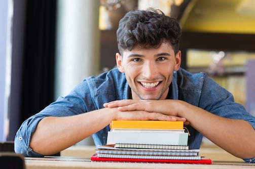 Guy with chin on book